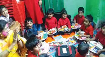 Children from a red-light district celebrating Holi.