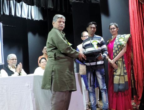 A student receiving the Bidyayan Scholarship at the annual award ceremony.