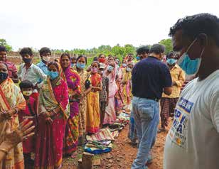 Local people gathering for essentials after cyclone Yaas.